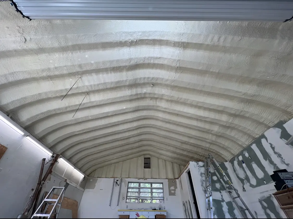 Spray polyurethane foam applied to the underside of a metal roof deck in Cascade